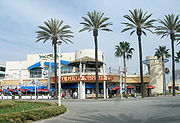 A two-story building has the sign 