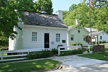 This is a color photo of Grant's birthplace:a small one story wood panel house.