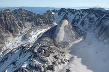 Large fairly smooth rock structure inside a crater