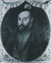 Miniature portrait of the Earl of Warwick, richly dressed in a slashed doublet with the Order of the Garter on a ribbon round his neck. He is a handsome man with dark eyes and dark goatee beard.