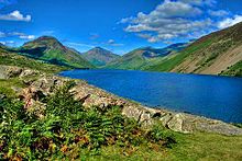 Blue lake between green hills.