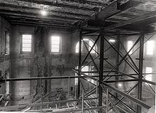 Inside of a building being renovated, with scaffolding