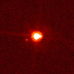 Eris (centre) and Dysnomia (left of centre), taken by the Hubble Space Telescope