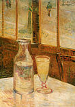 A table in a cafe with a bottle half filled with a clear liquid and a filled drinking glass of clear liquid