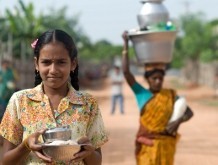 A girl with a woman in the background