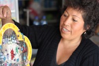 Woman making jewellery in Peru (Chavin)