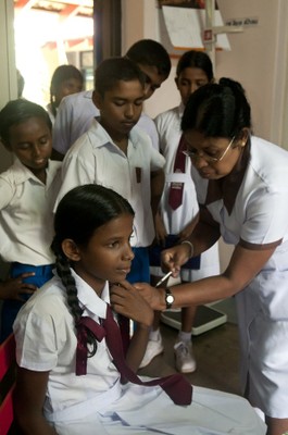 A doctor admininstering an injection